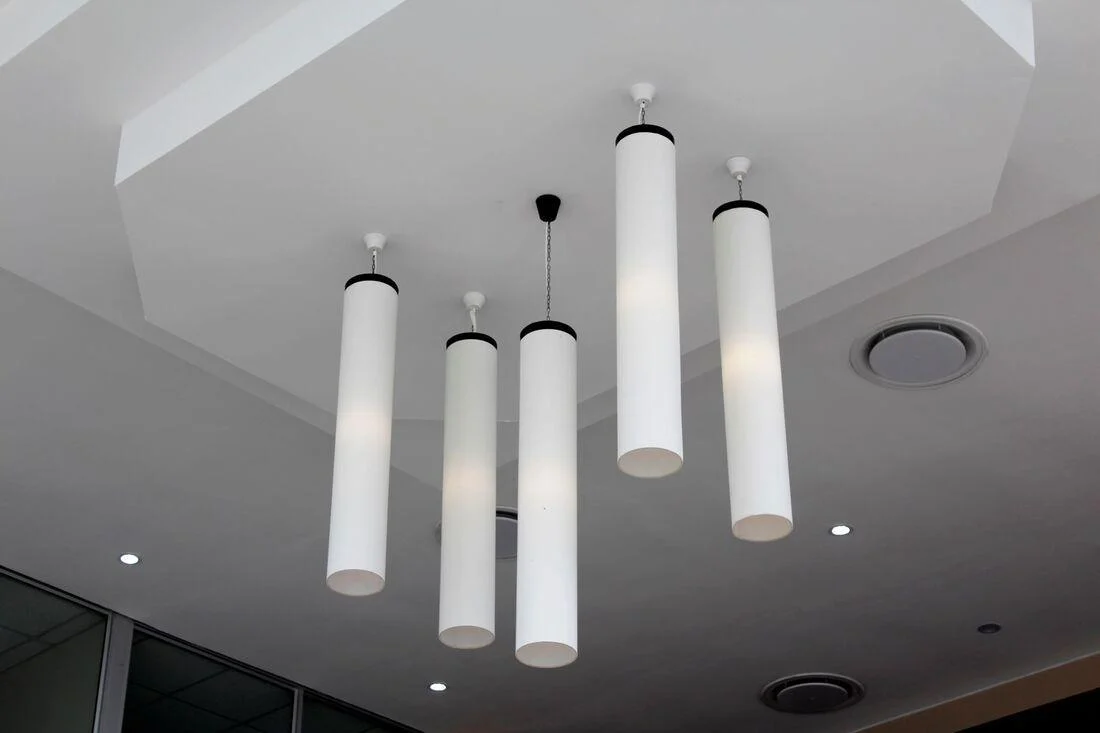 Pendant lights on a smooth plaster ceiling